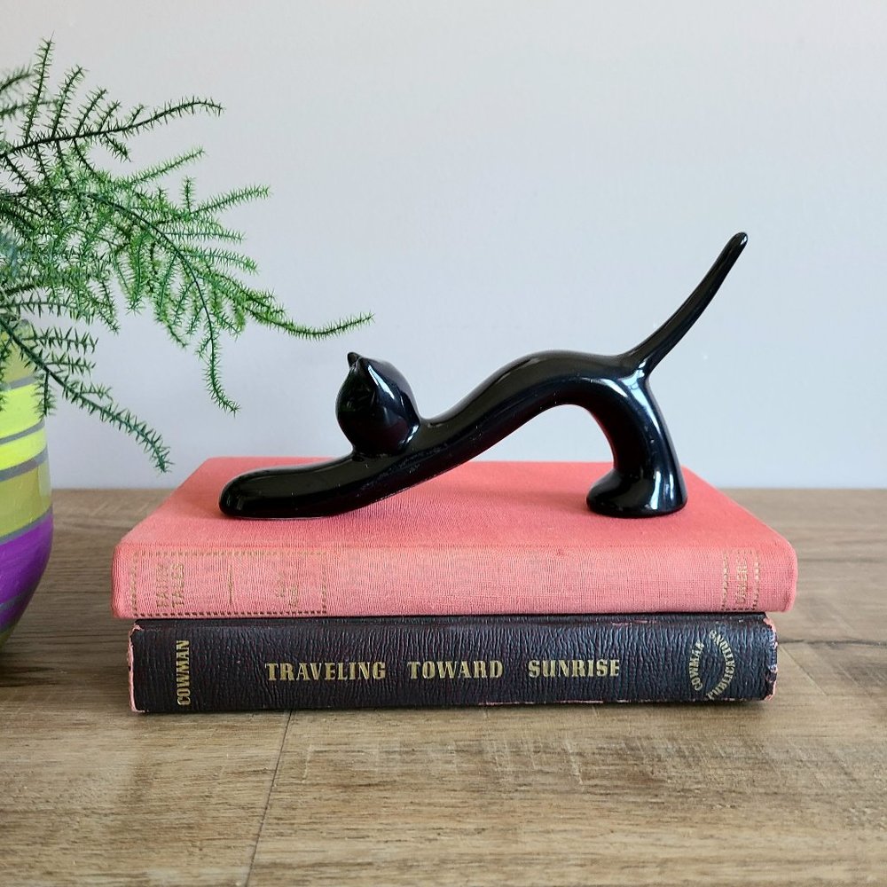 Black ceramic stretching cat figurine. Home Decor.